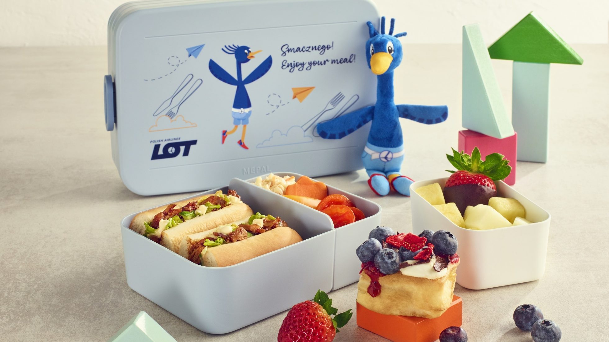 Na obrazku widoczne jest małe zdjęcie lunchboxa z posiłkiem.